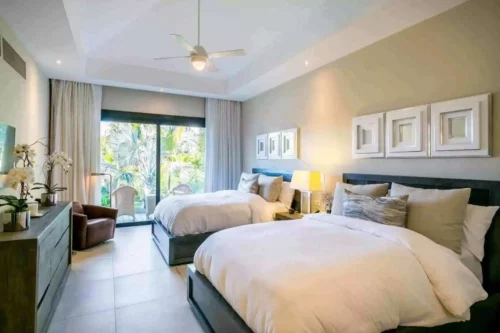 bedroom with 2 queen beds in a villa in Casa de Campo